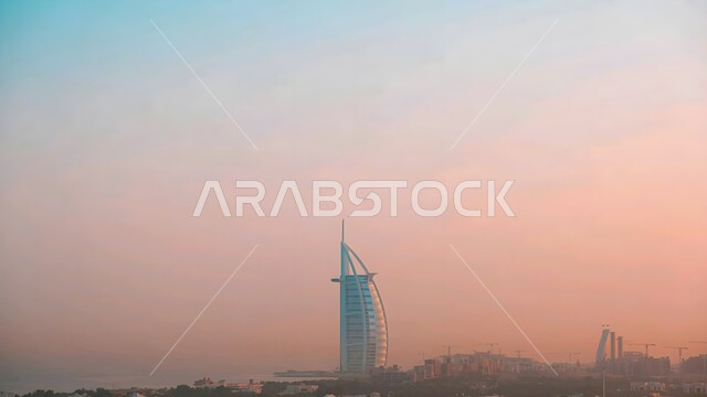 Architectural engineering art of building towers and skyscrapers, Burj Al Arab overlooking the sea in Dubai, tall buildings and structures, famous coastal tourist places in the United Arab Emirates, attracting and attracting tourists from all over the world