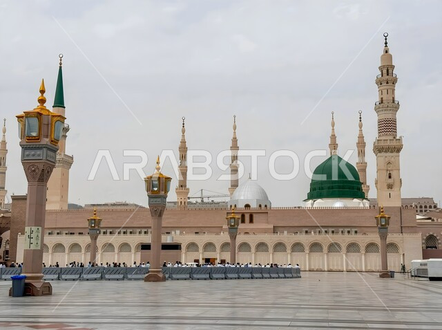 The sacred Islamic religious landmarks in the Kingdom of Saudi Arabia, the architectural engineering art of building mosques in the Islamic style, the green dome and the towering minarets, the outer courtyard of the Prophet’s Mosque in Medina, the concept of worship and drawing closer to God Almighty