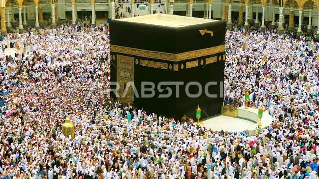 Pilgrims and Umrah performers circumambulate the Kaaba in the Grand Mosque in Mecca, performing Hajj and Umrah rituals, sacred Islamic religious landmarks in the Kingdom of Saudi Arabia, worship and drawing closer to God Almighty, visiting the Holy House of God in Mecca, a destination for Muslims from all over the world