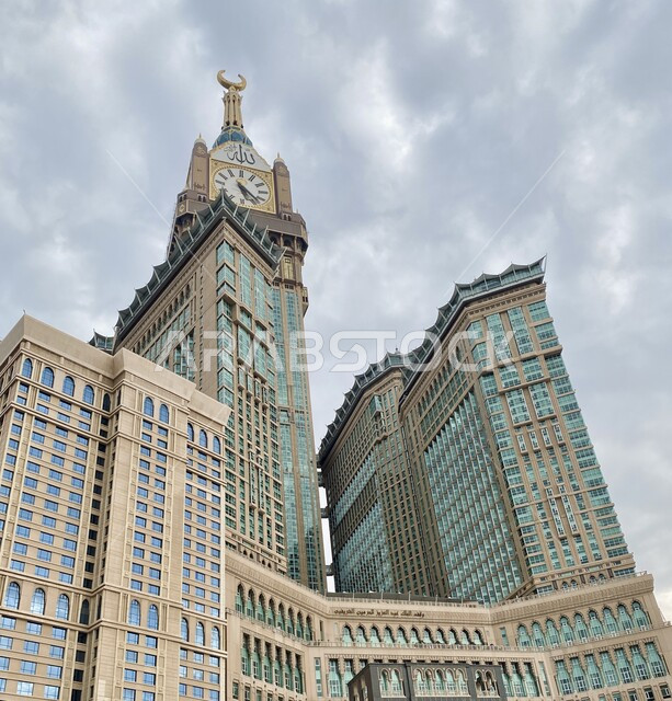 Makkah Royal Clock Tower during the day, performing Hajj and Umrah rituals, sacred Islamic religious places and landmarks, architectural engineering art of towers and skyscrapers, urban growth and progress of facilities and buildings in the Kingdom of Saudi Arabia, worship and closeness to God