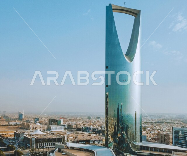 Kingdom Tower in Riyadh, architectural engineering art of building towers and skyscrapers, urban progress and growth, famous tourist places and landmarks in the Kingdom of Saudi Arabia, attracting and attracting tourists from all over the world