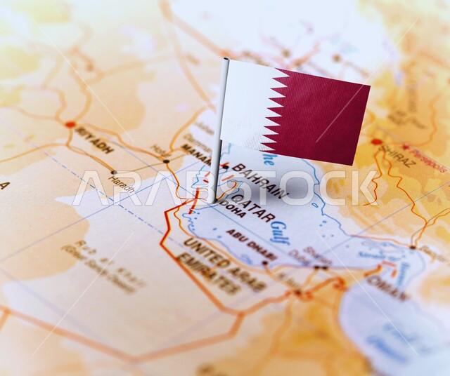 Determine the location and geographical borders of the country, the map of the Arab world and the Gulf countries, place and fix a mark over the State of Qatar, Arab cities and countries