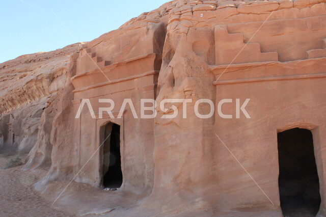 View of the heritage caves at the Al-Hijr archaeological site in the desert, ancient historical landmarks in Madain Saleh, tourist places in desert areas, rock formations and formations in Al-Ula in the middle of the deserts of the Kingdom of Saudi Arabia