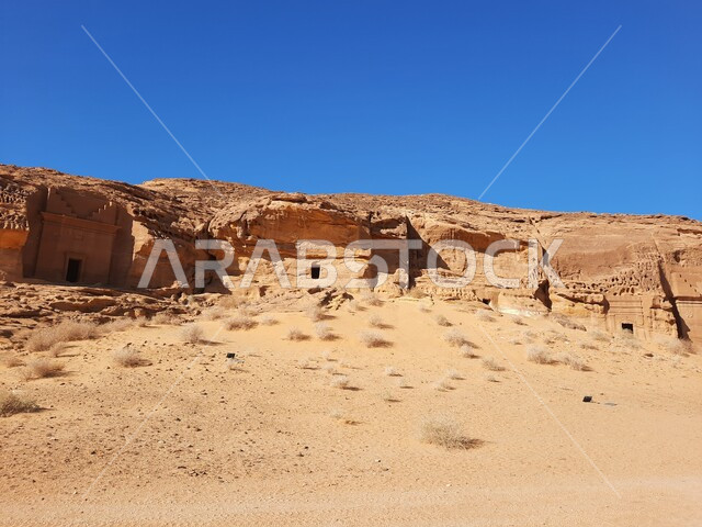 Tourist places in desert areas, rock formations and formations in AlUla in the middle of the deserts of the Kingdom of Saudi Arabia, ancient historical landmarks in Madain Saleh, heritage caves in the archaeological site of Al-Hijr in the desert