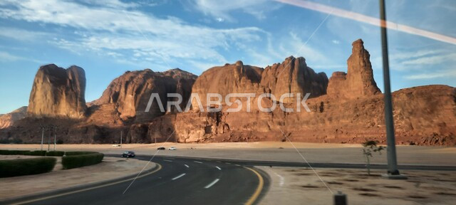 Paved asphalt streets and roads in the desert, rock formations and formations in AlUla in the middle of the deserts of the Kingdom of Saudi Arabia, ancient historical landmarks in Madain Saleh, tourist places in desert areas