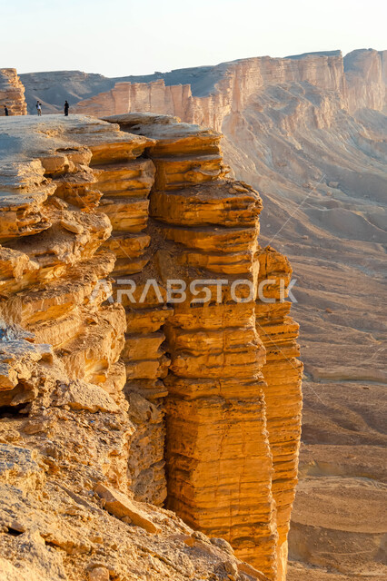 The Tuwaiq mountain range in Najd at sunset, desert nature and mountainous terrain in Saudi Arabia, famous natural tourist attractions, the rocky edge of the apocalypse in the Riyadh desert in the Kingdom of Saudi Arabia