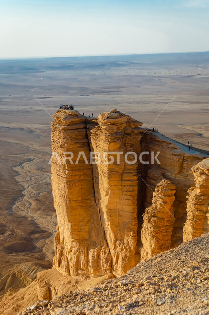 The Tuwaiq mountain range in Najd at sunset, desert nature and mountainous terrain in Saudi Arabia, famous natural tourist attractions, the rocky edge of the apocalypse in the Riyadh desert in the Kingdom of Saudi Arabia