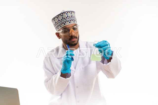 Biochemistry concept, integration of modern equipment and technology into practical life, conducting scientific experiments and research, close-up portrait of an Arab Gulf Omani laboratory specialist wearing a white coat and gloves using test tubes, white background