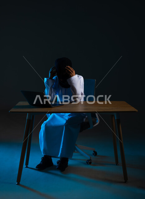 Destruction of digital accounts, use of computer for illegal purposes, concept of cybercrime, ability to hack devices, hacking and data theft, portrait of a masked Gulf Arab Omani hacker wearing a dishdasha, putting his hands on his head with an expression of annoyance, blue background