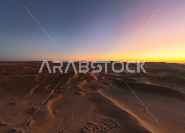 Soft golden dunes and natural terrain in Saudi Arabia, sand formations and formations in deserts, harsh and dry weather in barren lands, landscape and soft golden sand in desert at sunrise