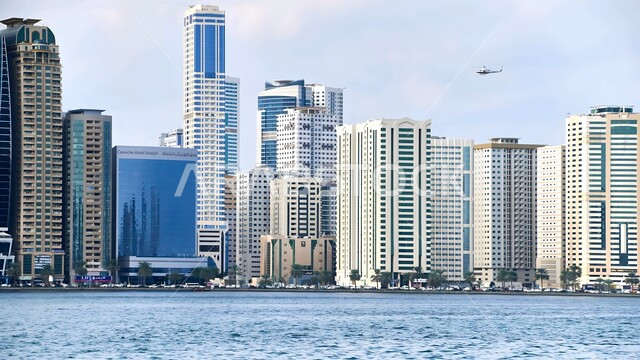 Attracting and attracting tourists from all over the world, residential and commercial high-rise buildings and facilities, the architectural art of towers and skyscrapers overlooking the sea in the city of Dubai, famous coastal tourist places in the United Arab Emirates