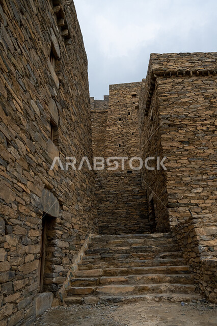Building constructed of stones and trunks of Sidr trees, a historical fort and castle, houses and buildings of the village of Dhi Al Ain in Al Baha region, renovation and preparation of heritage mountainous places to attract tourists from all over the world, famous tourist attractions