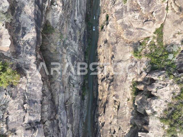 Highlands and mountain ranges, rock formations and formations in Jazan city, green plants planted on Al-Qahr Mountains, distinctive natural landscapes, famous tourist places and landmarks in the Kingdom of Saudi Arabia