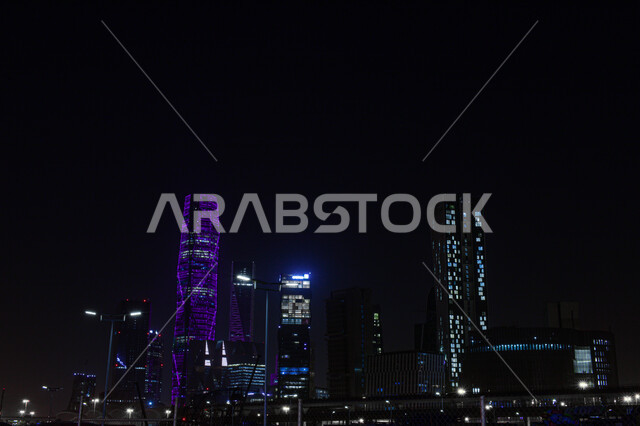 Urban growth and development of towers and skyscrapers illuminated at night, architectural art of buildings and economic facilities in the Kingdom of Saudi Arabia, King Abdullah Financial District (KAFD), famous places and landmarks in Riyadh