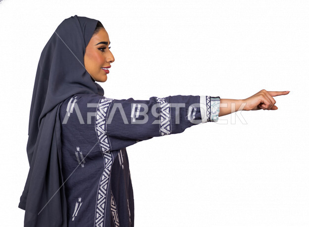 Portrait of a Saudi Arabian Gulf woman, making different hand gestures, pointing with the index finger, clicking on the screen, using the sense of touch to move the holographic elements, a young Saudi Muslim veiled woman wearing a Gulf abaya, white backgr