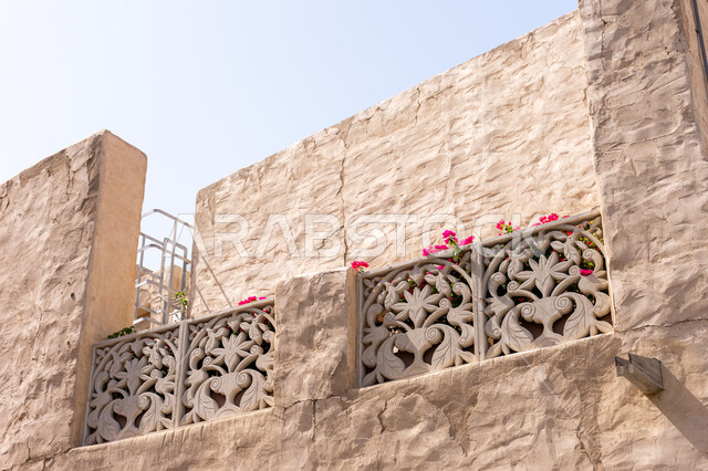 Wall of an old mud house in the Al Seef area of ​​Dubai, a historical archaeological building, attractions and tourist attractions from all over the world, old-style architectural art, famous heritage tourist places in the United Arab Emirates