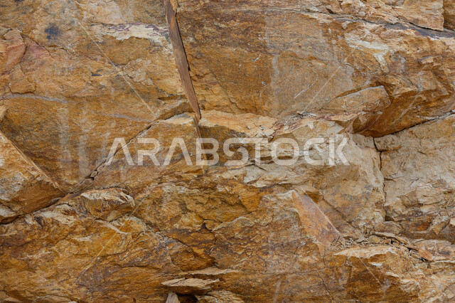 تصوير مقرب  لحجارة صخرية ، سطح رخام بني ، جبل صخري