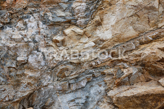 Close-up of boulder stones, brown marble surface, rocky mountain