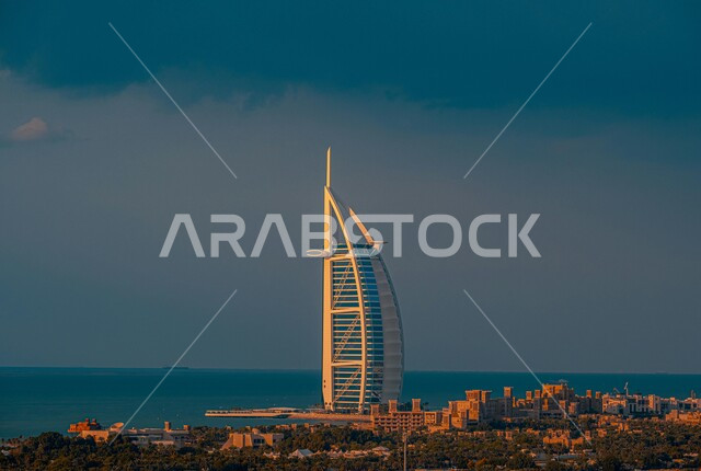 Luxury commercial and residential buildings and facilities, architectural engineering art in building towers and skyscrapers, Burj Al Arab overlooking the sea in Dubai, a famous tourist place and landmark, the coastal waterfront in the United Arab Emirates