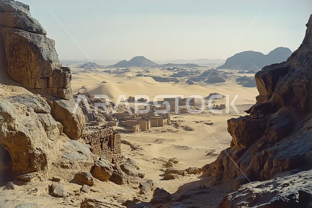Terrain and sand dunes, rock and stone formations in the desert of the Kingdom, rock formations and rugged slopes, landscape in a valley in Saudi Arabia, harsh and dry climate in the vast deserts, high mountain peaks and heights, clear blue sky background
