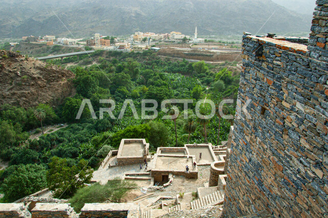 Famous historical landmarks in Saudi Arabia, ancient Arab architecture, rocky terrain, mountain peaks and heights, heritage stone buildings and houses, the ancient village of Dhi Ain in the city of Al Baha in the south of the Kingdom, natural places to attract and attract tourists
