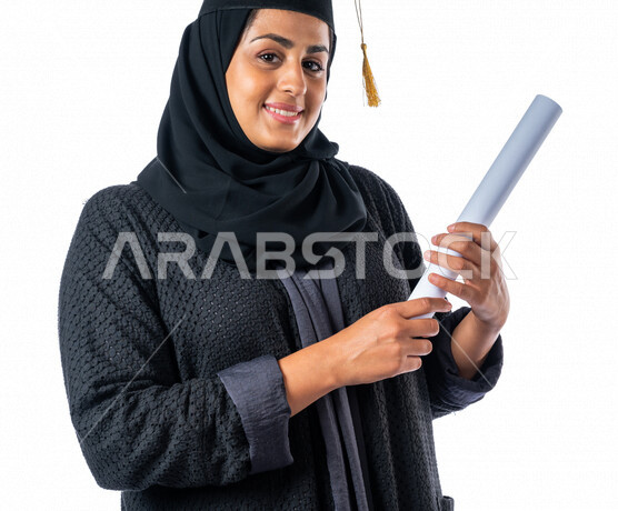 Portrait of an Arab Saudi Gulf university student holding her graduation certificate, facial and hands gestures indicating happiness with excellence and success, graduation ceremony, test results, outstanding student, schools and universities, education i