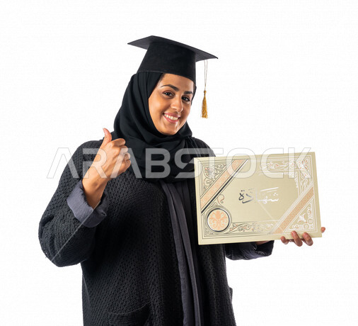 Portrait of an Arab Saudi Gulf university student holding her graduation certificate, facial and hands gestures indicating happiness with excellence and success, graduation ceremony, test results, outstanding student, schools and universities, education i