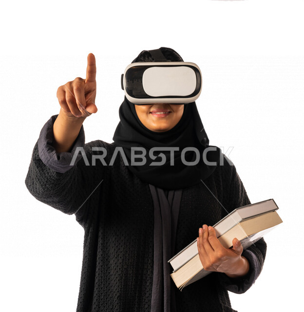 Portrait of a Saudi Arabian Gulf university student wearing virtual reality glasses, education using the 3D hologram feature, educational platforms based on virtual reality, education in the future, schools and universities, the development of science and