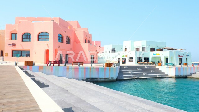 Colorful buildings in Katara on Doha Port, Qatar's waterfront, a blend of modern style and cultural heritage, famous coastal tourist attractions, tourist attractions