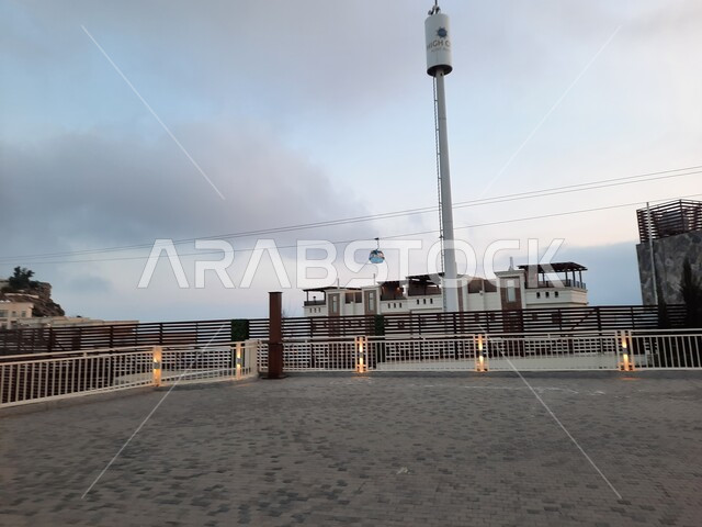 Places and tourist attractions in the Kingdom of Saudi Arabia, spending enjoyable times in the famous high areas, a high view from one of the roofs of residential buildings and commercial centers in the city of Abha in the Asir region, a view of the sky full of clouds