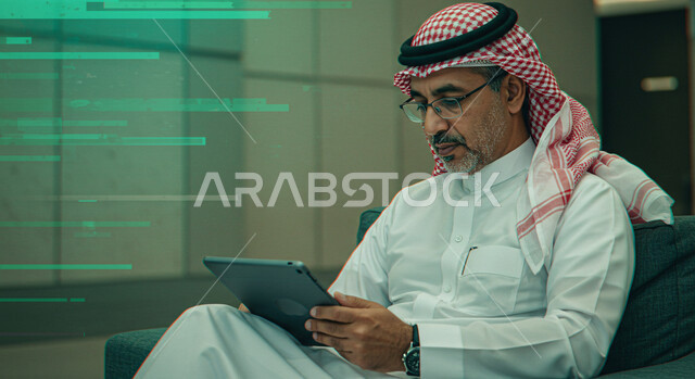 Spending time browsing social media, online shopping using tablet, completing tasks remotely, using modern technologies, Saudi Arabian Gulf man wearing traditional keffiyeh and thobe sitting on comfortable chair using tablet, green luminous hologram lines background