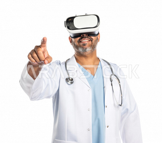 Portrait of a Saudi Gulf doctor wearing 3D virtual reality (VR) glasses and making various hand gestures, pointing with his index finger, clicking and pressing, using the sense of touch, the concept of modern electronic technologies, finger movement and g