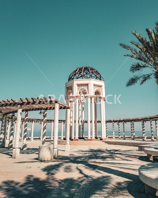 Kuwait's coastal waterfront, architectural art on Salmiya Beach in Kuwait City during the day, interest in planting palm trees, a famous tourist place and landmark, attracting and attracting tourists from all over the world