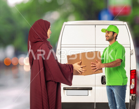 Portrait of a Saudi Arabian Gulf man working in the delivery of orders and goods, delivering goods to customers, a Saudi Arabian Gulf woman receiving her purchases, online shopping, online orders, smart shopping, reliable shipping and delivery process, de
