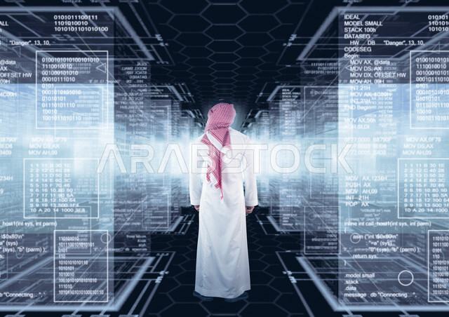 A young Saudi Arabian Gulf working as a web developer, using programming languages, developing and building websites and electronic applications, programming codes to build smart phone applications