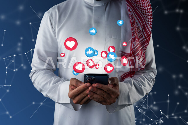 A close-up of a Saudi Arabian Gulf man in his hands a mobile phone, bubble bubbles for social media interactions, a set of interactive notifications for social media, interaction and social communication