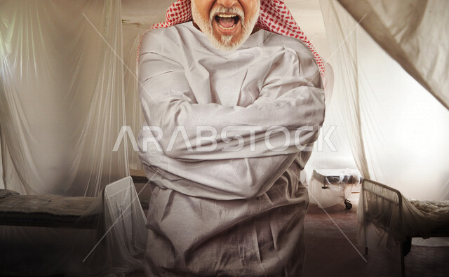 صورة لمريض نفسي عربي خليجي مكبل اليدين , يقيم في مصحة نفسية , اضطراب نفسي , معاناة وأزمة نفسية , الإكتئاب .