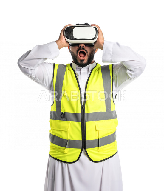 Portrait of a Saudi Arabian Gulf engineer wearing a work jacket and virtual reality glasses, facial gestures indicating surprise and shock, watching 3D elements, virtual designs, integrating virtual reality technology in architecture, white background