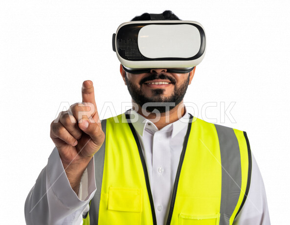 Portrait of a Saudi Arabian Gulf engineer wearing a work jacket and virtual reality glasses, pointing with the index finger to a specific goal, using virtual reality technology in architecture, white background