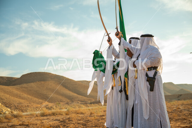 فرقة للاحتفال بالعيد الوطني بالرقص بالسيوف وقرع الطبول، ذكرى تأسيس الدوله السعوديه الأولى ١٧٢٧ م، عروض الفلكلور التراثي في إحدى المناطق الصحراوية بالمملكة، مفهوم حب الوطن والانتماء إليه، يوم بدينا ٢٢ فبراير، ارتداء زي العرضة النجدية الشعبية في مناسبة وطنية