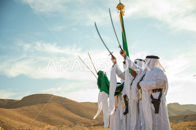 ارتداء زي العرضة النجدية الشعبية في مناسبة وطنية، فرقة عروض الفلكلور التراثي في احدى المناطق الصحراوية بالمملكة، مفهوم حب الوطن والانتماء إليه، يوم بدينا ٢٢ فبراير، ذكرى تأسيس الدوله السعوديه الأولى ١٧٢٧ م، الاحتفال بالعيد الوطني بالرقص بالسيوف وقرع الطبول 