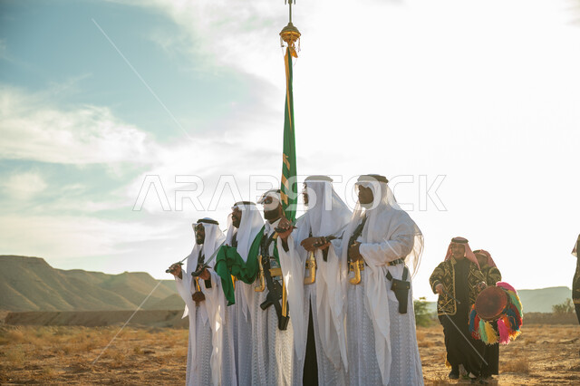 ذكرى تأسيس الدوله السعوديه الأولى ١٧٢٧ م، عروض الفلكلور التراثي في إحدى المناطق الصحراوية بالمملكة، مفهوم حب الوطن والانتماء إليه، فرقة للاحتفال بالعيد الوطني بالرقص بالسيوف وقرع الطبول، يوم بدينا ٢٢ فبراير، ارتداء زي العرضة النجدية الشعبية في مناسبة وطنية