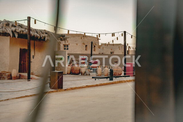 Ancient clay architectural art, historical archaeological sites, tourism in AlUla, stalls selling popular pottery jars and heritage jars in the old town market in AlUla, famous cultural tourist attractions in the Kingdom of Saudi Arabia