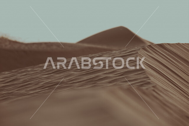 Aesthetic view of desert sand dunes in Saudi Arabia, fine sand.