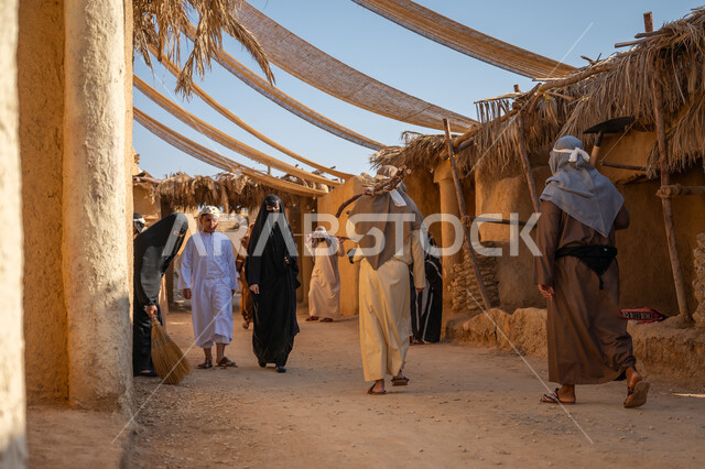 التجول في الاحياء الشعبيه بين البيوت الطينية التراثية, أعمال وصناعات يدوية، مهنة وحرفة شعبية، ارتداء الزي الشعبي في المناسبة الوطنيه، بيت طيني تراثي قديم, يوم بدينا 22 فبراير, ذكرى تاسيس الدوله السعوديه الاولى 1727 م