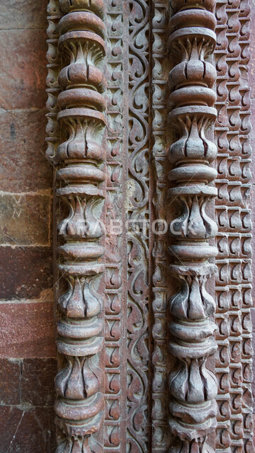 A close-up of some decorative shapes carved on the rocks, stone shapes, decorative details, stone carving