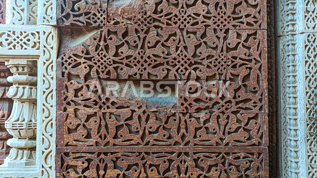 A close-up of some decorative shapes carved on the rocks, stone shapes, decorative details, stone carving