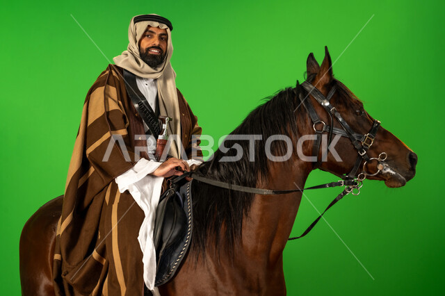 Pride and pride in national identity, Saudi National Day September 23, portrait of a Saudi Arabian Gulf man wearing traditional dress riding an Arabian horse, our day is February 22, the anniversary of the founding of the first Saudi state 1727 AD, inheritance of the love of horses from ancestors, passion for raising and caring for horses, green background, chroma key