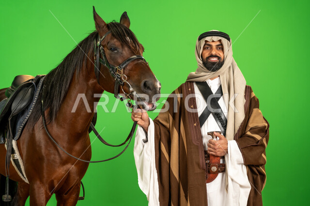 Pride and pride in national identity, Saudi National Day September 23, portrait of a Saudi Arabian Gulf man wearing traditional dress standing next to an Arabian horse, our day is February 22, the anniversary of the founding of the first Saudi state 1727 AD, inheritance of the love of horses from ancestors, passion for raising and caring for horses, green background, chroma key