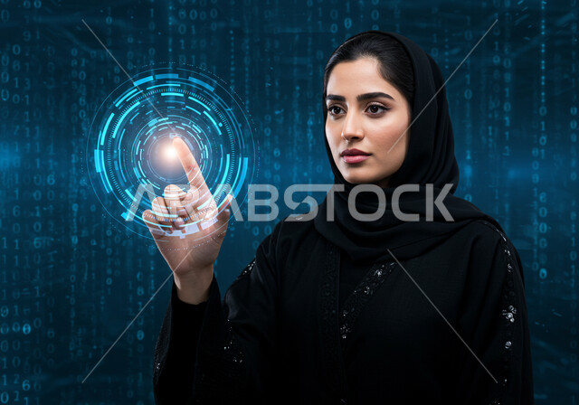 التقدم والنمو التكنولوجي، تحسين كفاءة العمل، استخدام التقنيات الالكترونية الحديثه، مفهوم تنمية الاعمال والاقتصاد، رموز وعناصر هولوجرامية ثلاثية الابعاد، صورة مقربة لامرأة عربية خليجية سعودية محجبة ترتدي عباءة سوداء تقوم بلمس أيقونات افتراضية زرقاء 